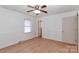 Spacious bedroom with wood floors, ceiling fan and access to bathroom at 105 Kiser Ln, Statesville, NC 28677