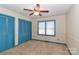 Bedroom with blue closet doors and a ceiling fan at 105 Kiser Ln, Statesville, NC 28677