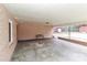 Covered patio with concrete floor and bench; view of backyard at 105 Kiser Ln, Statesville, NC 28677