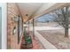 Covered porch with rocking chairs and view of street at 105 Kiser Ln, Statesville, NC 28677