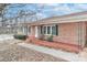 Front porch of brick ranch house with rocking chairs at 105 Kiser Ln, Statesville, NC 28677