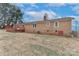 Brick house with wooden deck and fenced backyard at 105 Kiser Ln, Statesville, NC 28677