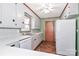 Kitchen features white cabinets, stainless steel sink, and dishwasher at 105 Kiser Ln, Statesville, NC 28677