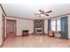 Living room features hardwood floors and ceiling fan at 105 Kiser Ln, Statesville, NC 28677