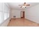 Living room with light walls, wood floors, and ceiling fan at 105 Kiser Ln, Statesville, NC 28677