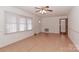 Living room with light walls, wood floors, and ceiling fan at 105 Kiser Ln, Statesville, NC 28677