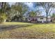 Spacious backyard with deck and mature trees at 11800 Five Cedars Rd, Charlotte, NC 28226