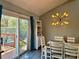 Charming dining area filled with natural light that leads to a backyard deck at 11800 Five Cedars Rd, Charlotte, NC 28226