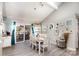 Well-lit dining room with modern lighting, views to the deck, and sleek flooring at 11800 Five Cedars Rd, Charlotte, NC 28226