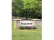 Stone sign for the Meadowbrook neighborhood, complemented by manicured landscaping at 11800 Five Cedars Rd, Charlotte, NC 28226
