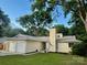 Charming one-story home with attached two-car garage, inviting entryway, and well-maintained front yard at 11800 Five Cedars Rd, Charlotte, NC 28226