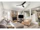 Living room with stone fireplace and large sectional sofa at 11800 Five Cedars Rd, Charlotte, NC 28226