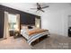 Primary bedroom with king bed, and neutral decor at 193 Willow Valley Dr, Mooresville, NC 28115