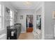 Chic bathroom with closet, chandelier lighting, granite countertop vanity and storage bench at 2106 Yellowstone Dr, Fort Mill, SC 29707