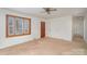 Living room with bay window and neutral carpeting at 6245 Cross Creek Ln, Charlotte, NC 28212