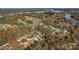 Breathtaking aerial view of lakeside homes surrounded by lush trees with fall foliage at 6249 Hayden Dr, Hickory, NC 28601