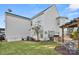 Backyard featuring a patio with outdoor seating and a built-in grill at 13929 Tilesford Ln, Huntersville, NC 28078