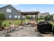 Backyard patio featuring a pergola, outdoor seating, and a built-in grill at 13929 Tilesford Ln, Huntersville, NC 28078