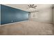 Bedroom boasts generous natural light and neutral carpeting throughout at 13929 Tilesford Ln, Huntersville, NC 28078