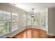 Bright breakfast nook with large windows and hardwood floors at 13929 Tilesford Ln, Huntersville, NC 28078