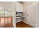 Entryway with built-in desk and hardwood floors at 13929 Tilesford Ln, Huntersville, NC 28078