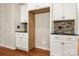 Kitchen cabinets with granite countertops and backsplash at 13929 Tilesford Ln, Huntersville, NC 28078
