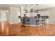 Spacious living area with a kitchen island and hardwood floors at 13929 Tilesford Ln, Huntersville, NC 28078