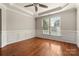 This dining room features hardwood floors, large windows, and wainscoting at 13929 Tilesford Ln, Huntersville, NC 28078