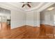 The living room features hardwood floors, wainscoting, and crown molding at 13929 Tilesford Ln, Huntersville, NC 28078