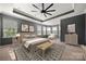 Relaxing main bedroom with tray ceilings, natural light, and elegant furnishings at 13929 Tilesford Ln, Huntersville, NC 28078