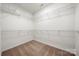 A large walk-in closet featuring wire shelving for optimized storage solutions and organization at 13929 Tilesford Ln, Huntersville, NC 28078