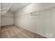 Walk-in closet featuring neutral carpet, white wire shelving, and neutral walls at 13929 Tilesford Ln, Huntersville, NC 28078