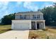 Charming two-story home featuring a two-car garage and stone accents at 204 Lake George Dr, Shelby, NC 28152
