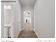 Bright hallway with an arched doorway leading to the kitchen and bathrooms at 204 Lake George Dr, Shelby, NC 28152