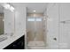 Modern bathroom with a glass enclosed shower, vanity and stylish fixtures at 208 Waterlynn Ridge Rd # B, Mooresville, NC 28117
