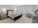 Bright bedroom features a large window, neutral color palette, and comfortable seating area at 208 Waterlynn Ridge Rd # B, Mooresville, NC 28117