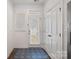 Bright entryway with a glass door, window, and patterned floor mat at 208 Waterlynn Ridge Rd # B, Mooresville, NC 28117