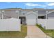Townhome exterior with a private backyard, a garage, and fenced yard at 208 Waterlynn Ridge Rd # B, Mooresville, NC 28117