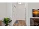 Bright foyer with hardwood floors, white walls, and a view of the front door at 208 Waterlynn Ridge Rd # B, Mooresville, NC 28117
