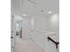 Upstairs hallway with neutral carpet and staircase visible in the background at 208 Waterlynn Ridge Rd # B, Mooresville, NC 28117