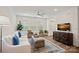 Cozy living room with a plush sofa, stylish decor, and a large window at 208 Waterlynn Ridge Rd # B, Mooresville, NC 28117