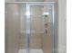 Tiled stand-up shower features built-in shelves and clear glass door at 208 Waterlynn Ridge Rd # B, Mooresville, NC 28117