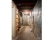 Unfinished basement area with utilities visible and foil-covered wall at 7324 Pebblestone Dr # F, Charlotte, NC 28212