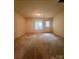 Unfinished basement area featuring a walkout to the exterior at 7324 Pebblestone Dr # F, Charlotte, NC 28212