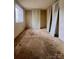 Bedroom featuring carpet floors, closet, and a window for natural light at 7324 Pebblestone Dr # F, Charlotte, NC 28212
