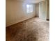 Bedroom featuring carpet floors, closet, and a window for natural light at 7324 Pebblestone Dr # F, Charlotte, NC 28212