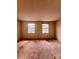 Spacious bedroom featuring two windows and neutral walls ready for personalization at 7324 Pebblestone Dr # F, Charlotte, NC 28212