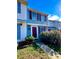 Charming townhome with colorful shutters and a well-maintained front garden with flowering bushes at 7324 Pebblestone Dr # F, Charlotte, NC 28212