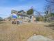 House backyard with a deck and playset at 154 W End St, Chester, SC 29706