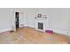 Hardwood floor bedroom with fireplace and access to another room at 154 W End St, Chester, SC 29706